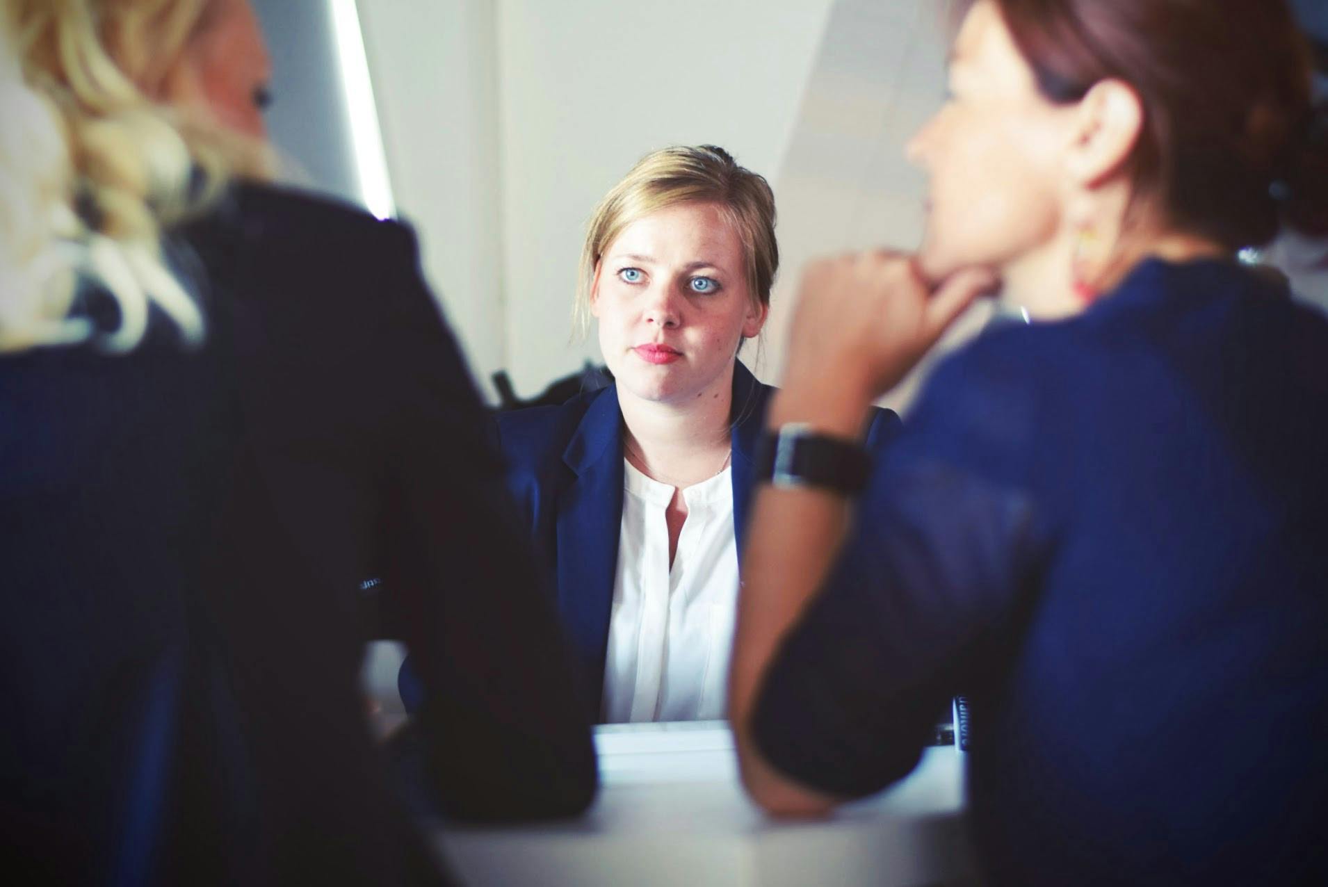 Three people having a business meeting.